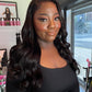 a woman with long hair in a black shirt