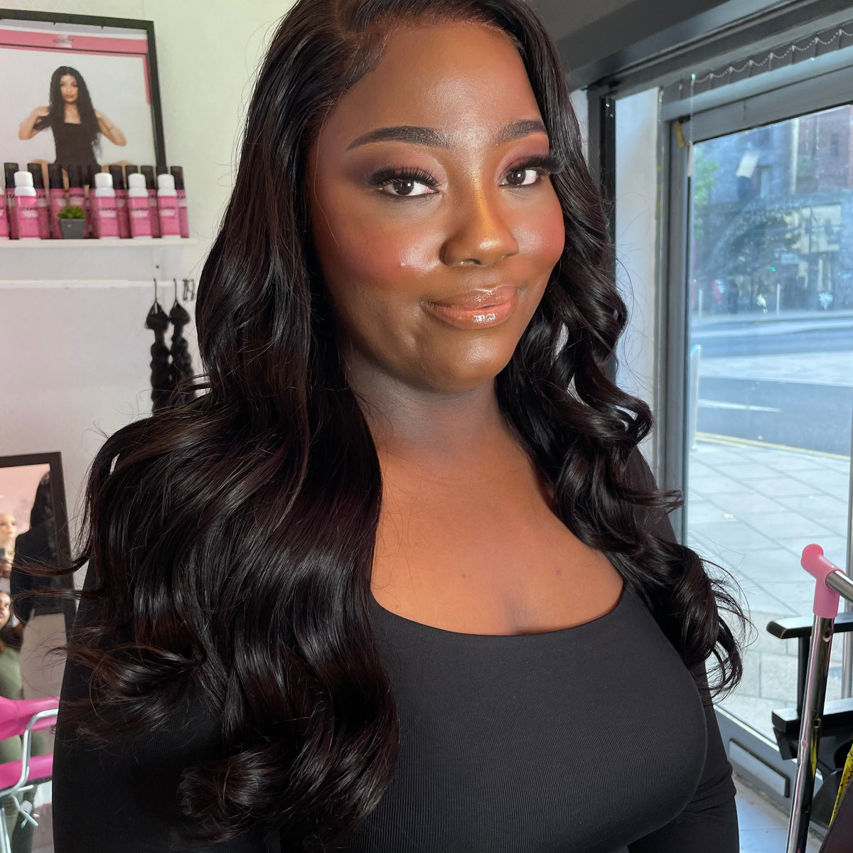 a woman with long hair in a black shirt