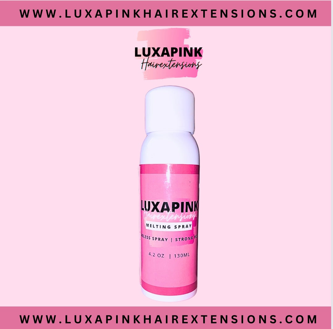 a pink bottle of hair spray