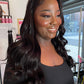 a woman with long hair smiling