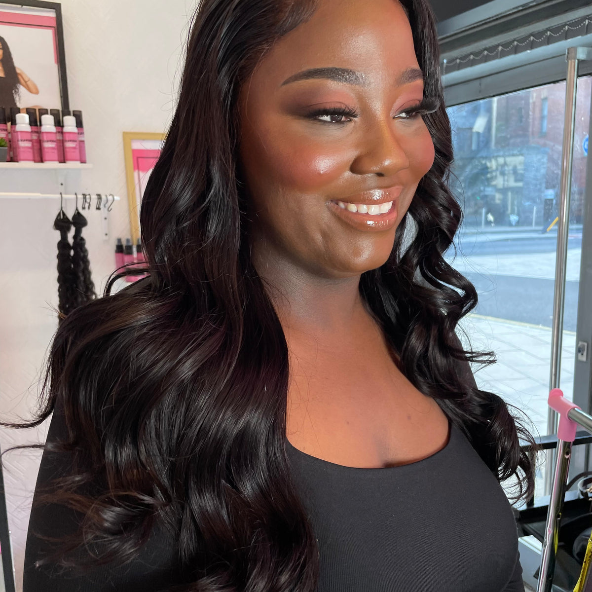a woman with long hair smiling