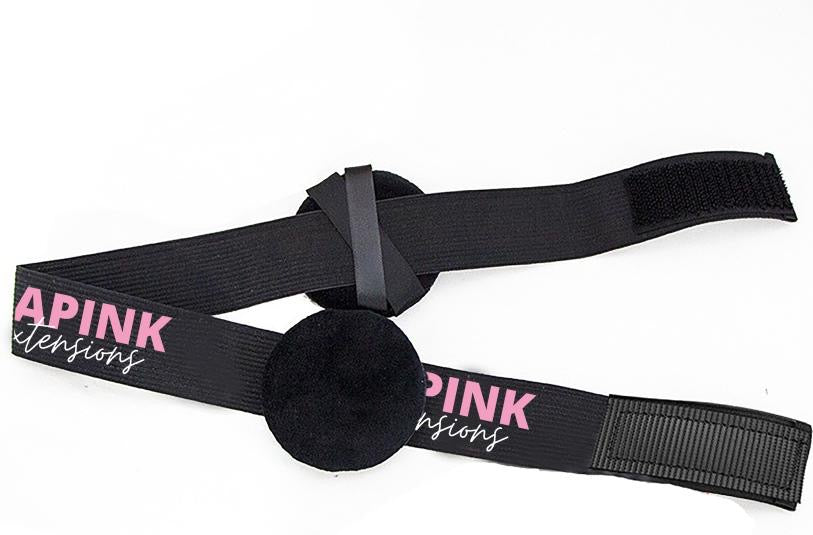a black strap with pink text