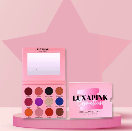a pink palette of eyeshadow and a pink box