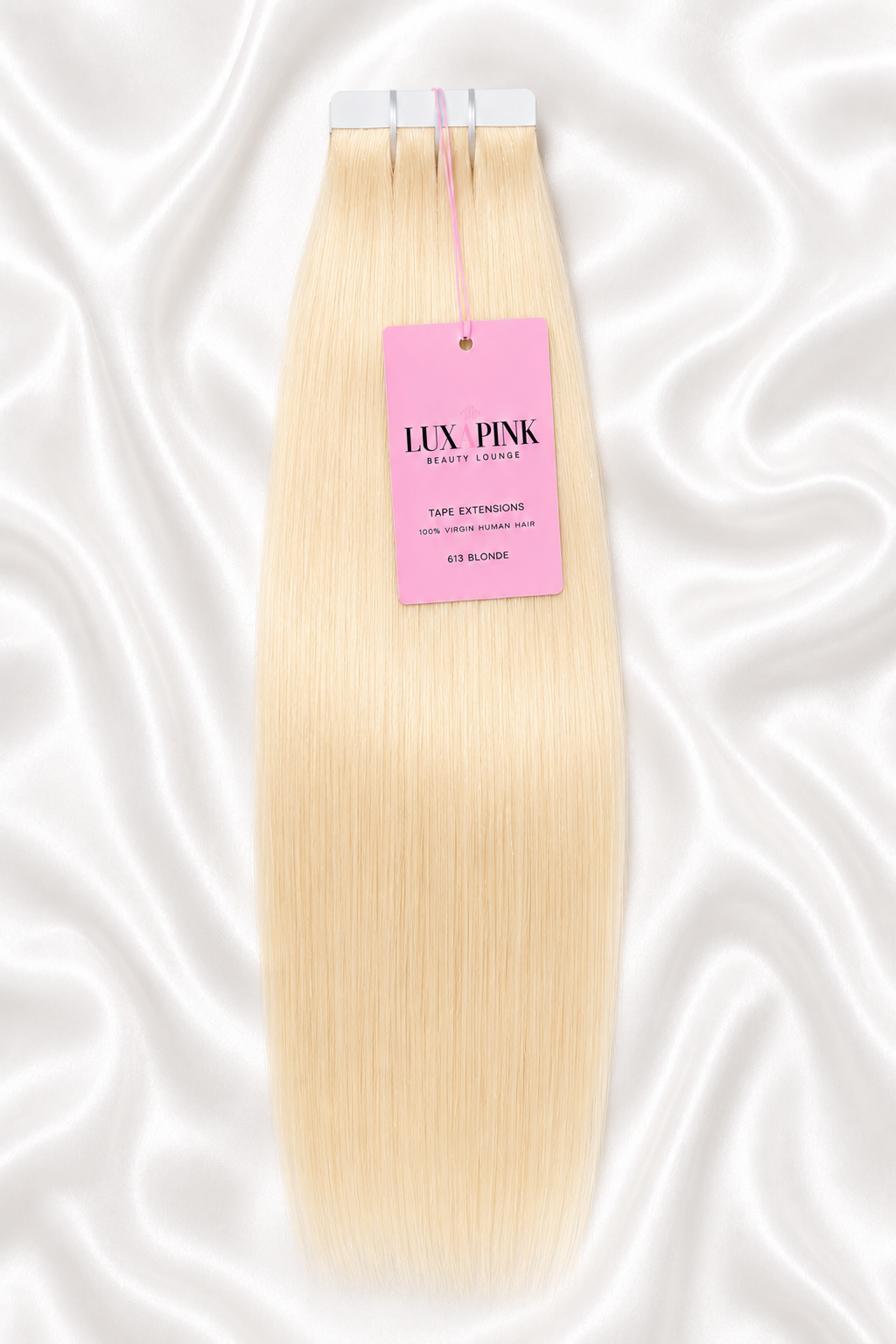 a piece of blonde hair with a pink tag on it