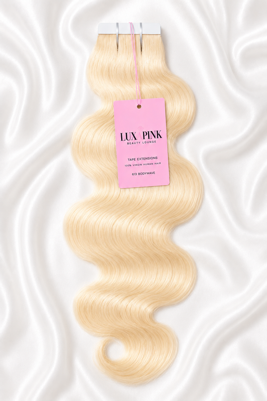 a blonde hair piece with a pink tag