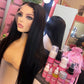 a mannequin with long black hair and a pink bag with bottles