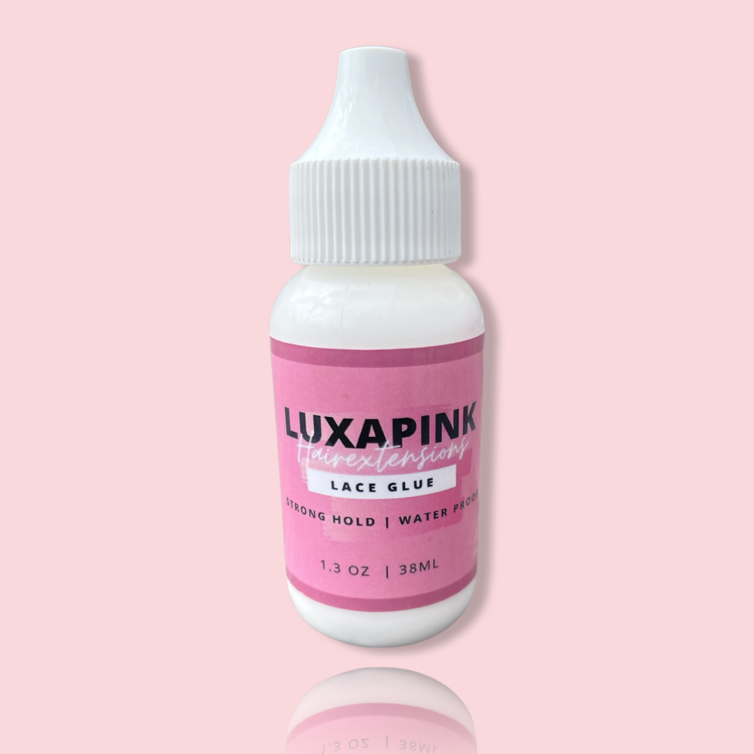 a white bottle with a pink label
