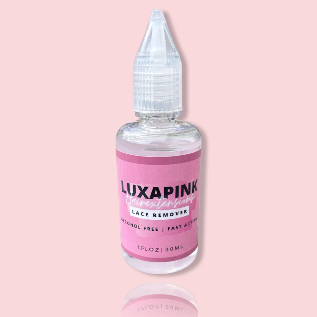 a bottle of liquid with a pink label