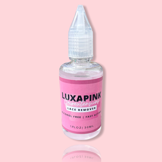 a bottle of liquid with a pink label