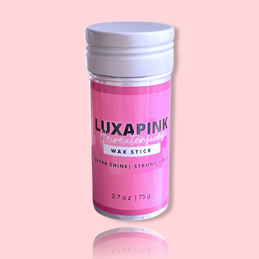 a pink and white bottle with a white cap